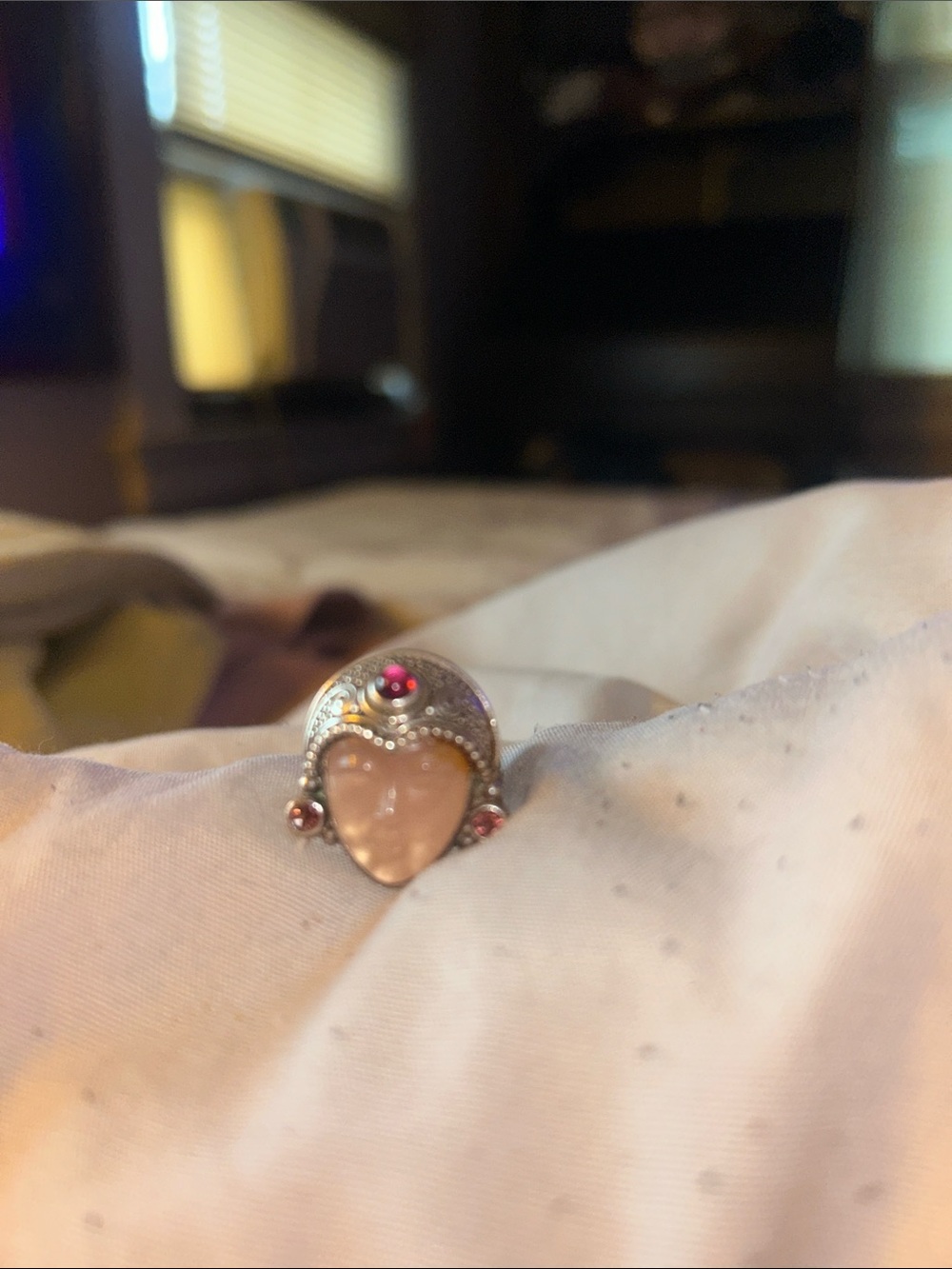 Princess ring. Carved stone rose quartz. Small garnets accents.